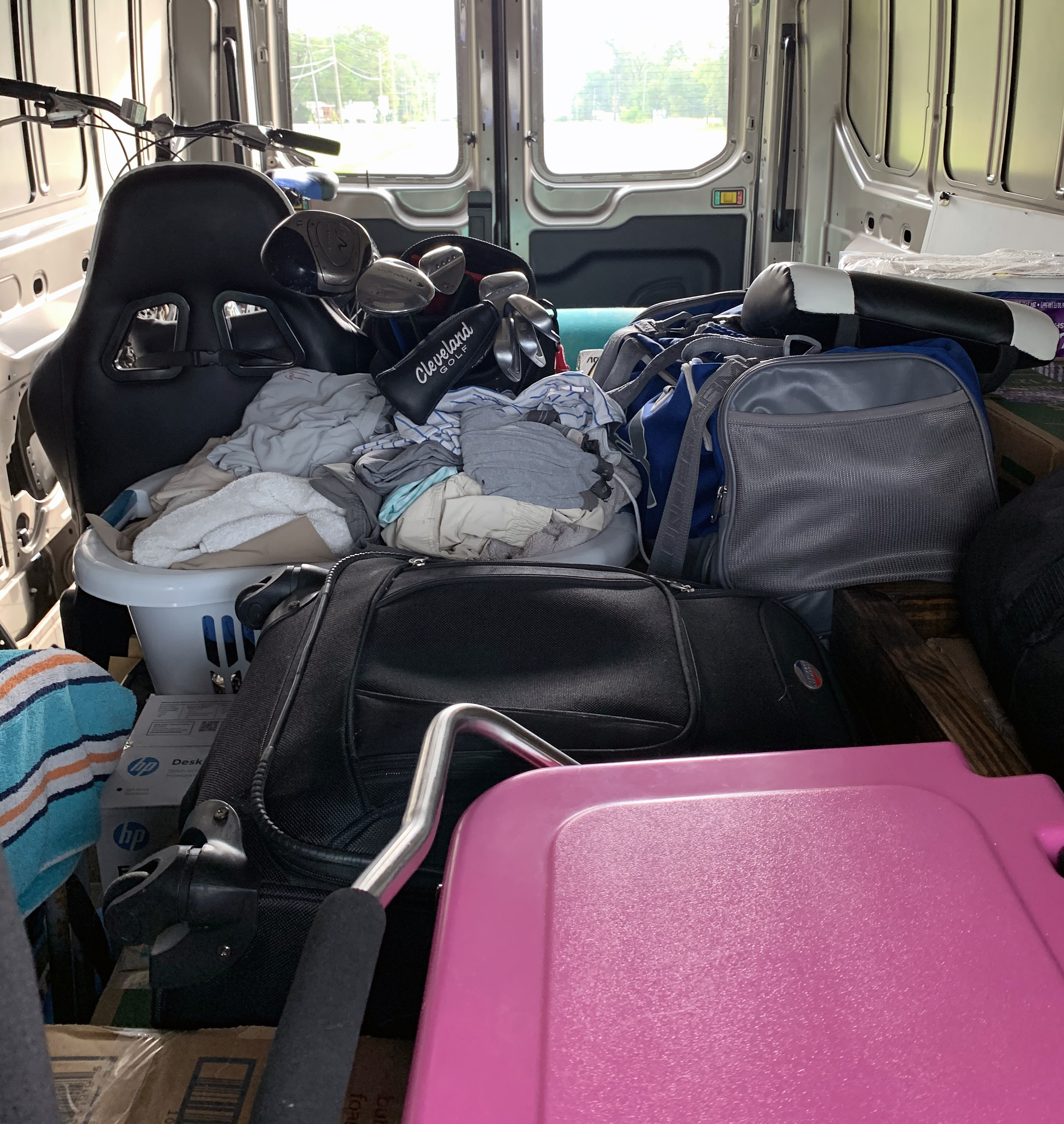 Inside 2020 Ford Transit 250 cargo van packed with belongings 
