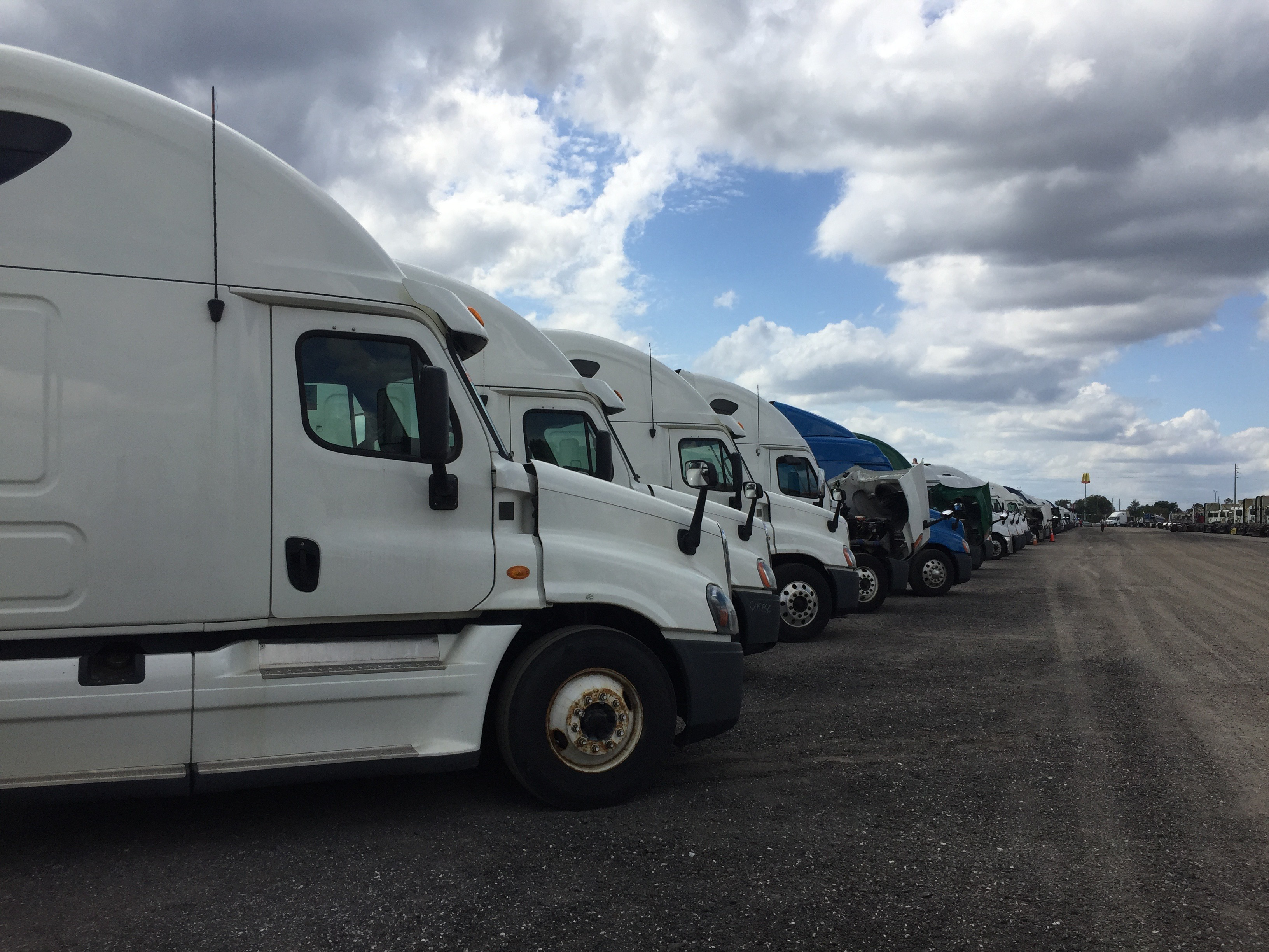 Semi-trucks parked in a row