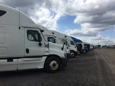 Trucking industry experts say CARB’s proposed Omnibus Regulations will drive up sales of used trucks like these shown here in February at a Ritchie Bros. auction in Orlando.
