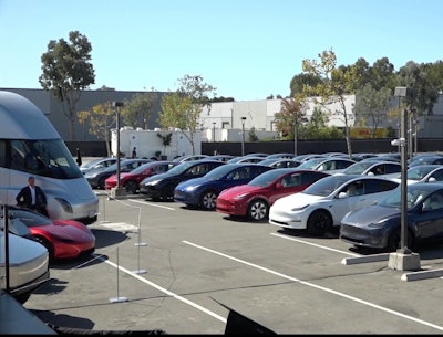 A screenshot of Tesla’s livestream of its socially distant event held Tuesday. Attendees and shareholders at in their Teslas in the lot and honked in lieu of clapping.