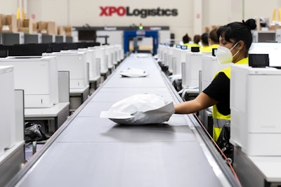 XPO warehouse workers don PPE — a priority for the company since the onset of the pandemic, said Wilkerson.