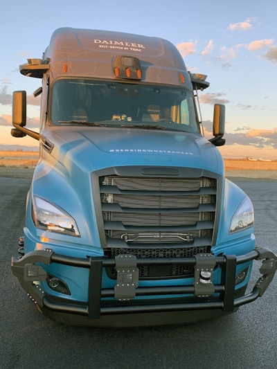 Parked inside Daimler Trucks North America’s (DTNA) Madras, Oregon, proving grounds is a unique Cascadia. What looks like a neck halo from a distance is actually a sophisticated network of cameras and sensors mounted above the doors that enable driverless driving. Several more are clustered inside the cab at the top of the windshield.