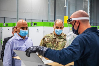 Operation Warp Speed co-leaders Dr. Moncef Slaoui and General Gus Perna visit a UPS Freezer Farm in Louisville, Kentucky. The visit was among several industry visits solidifying distribution solutions and the mission’s whole-of-America approach. Photo by Ryan Davis/UPS