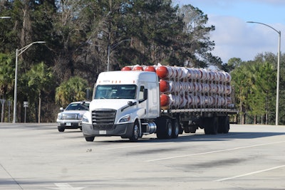 flatbed truck hauling on the road