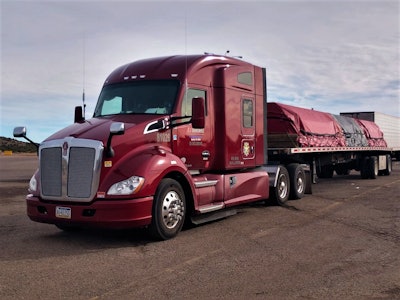JLE Industries tractor with flatbed trailer