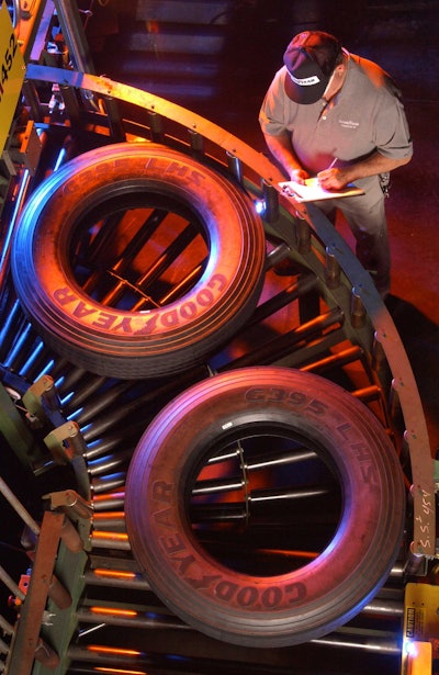 A Goodyear Tire & Rubber Company associate keeps an eye on truck tires traveling through the company’s Danville, Virginia, manufacturing plant as they head toward inspection.