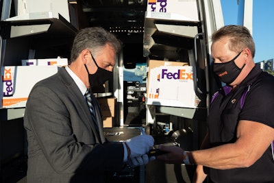 FedEx Express driver delivering package