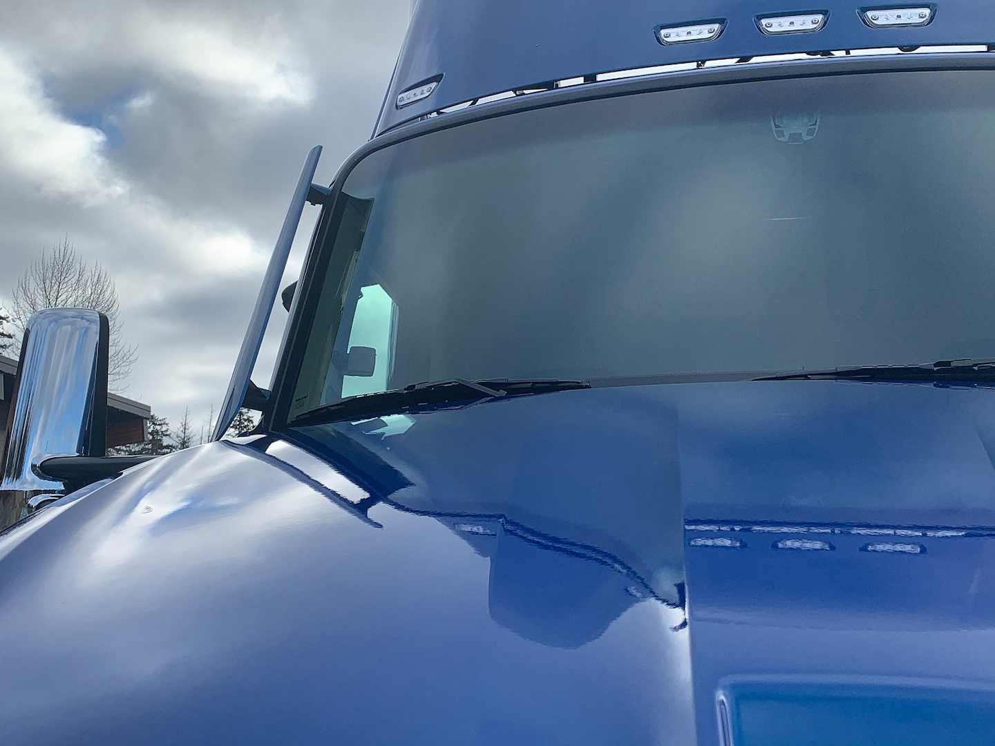 A-pillar mounted turning vanes reduce drag by keeping air along the side of the truck and trailer.