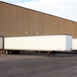 Semi-truck trailers parked at a warehouse
