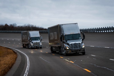 Two truck convoy testing autonomous vehicle technology on highway