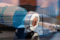 Semi-truck with COVID-19 vaccine and needle