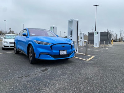 Grabber Blue Mach-E at a charging station