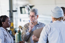 A group of team members discussing work