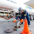 man adding fuel to truck