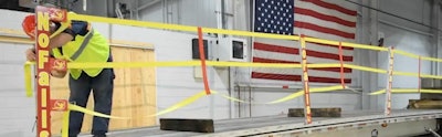 NoFalls, a network of stakes and straps that creates a split-rail-type barrier along edge of the trailer, also acts as a guide wire when walking along the deck, much like a handrail on a staircase.