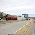 Overturned tractor-trailer on a busy highway