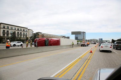 Overturned tractor-trailer on a busy highway
