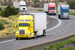 4 semi trucks on highway
