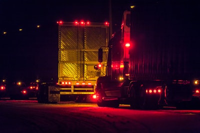 semi trucks in the dark with red led lights glowing