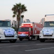 3 electric vehicles parked on road