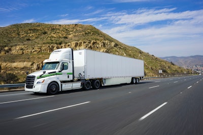 penske truck driving on roadway