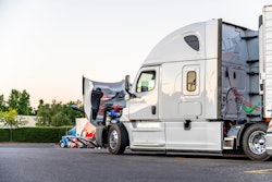 semi truck parked with hood up