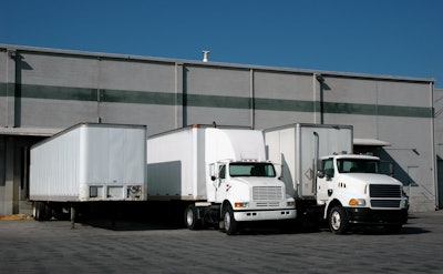 trucks and trailers at a loading dock