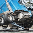 truck leaning on side at wreck site