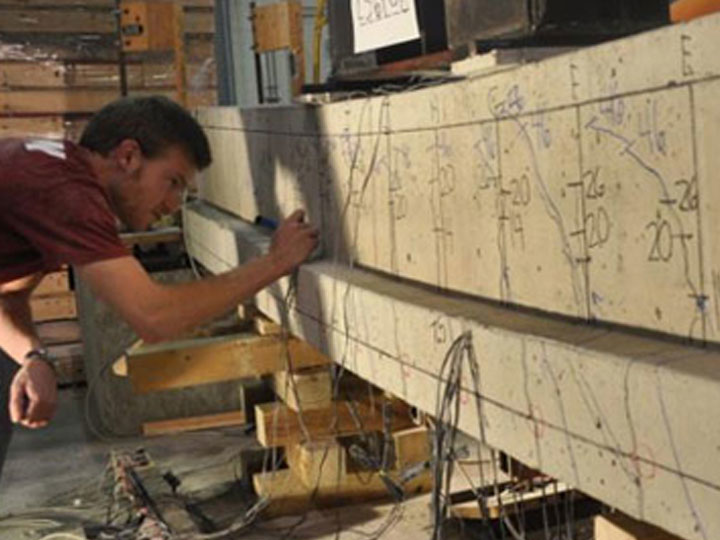 student working on a bridge