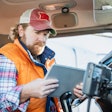 Truck driver using tablet