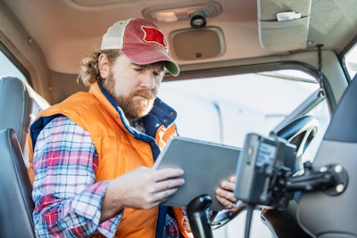 Truck driver using tablet