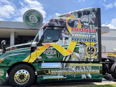 Old Dominion Freight Line’s new Ride of Pride-wrapped tractor from Daimler Trucks sits on display outside the company's corporate office in Thomasville, North Carolina. The truck, which features a patriotic graphic that honors American servicemen and women, will be adopted into the fleet and will travel between U.S. service centers over the next few years. Veterans at each location will have the opportunity to drive it.