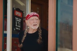 In a brief, humorous ad posted recently by FedEx, Willie Nelson becomes captivated by an electric FedEx step van, the GM BrightDrop EV600.