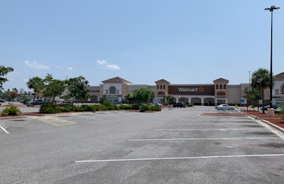 Canary in the coal mine? An ordinarily bustling Walmart in Lynn Haven, Fla. sits mostly idle save for workers inside tasked with sanitizing the store following a rise in COVID infections. ACT Research says it's too early to tell if Walmart's temporary store closures amid rising COVID cases hint at major economic interruptions to come.