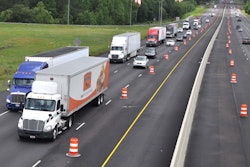 traffic on highway with inside lanes blocked off