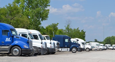 PS Logistics trucks in a parking lot