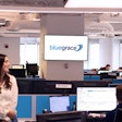 BlueGrace Logistics' employees sitting at their desks