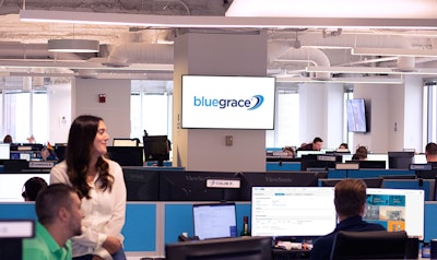 BlueGrace Logistics' employees sitting at their desks