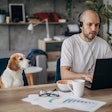Man working from home with dog
