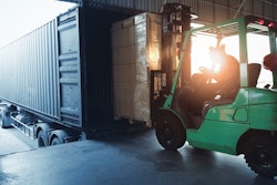 forklift loading a trailer