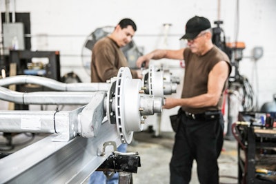 men working on a trailer