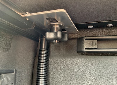 The MX4 cover can be quickly removed by unthreading two star knobs located on either side of the cover. The gutter drain tube is in the background.