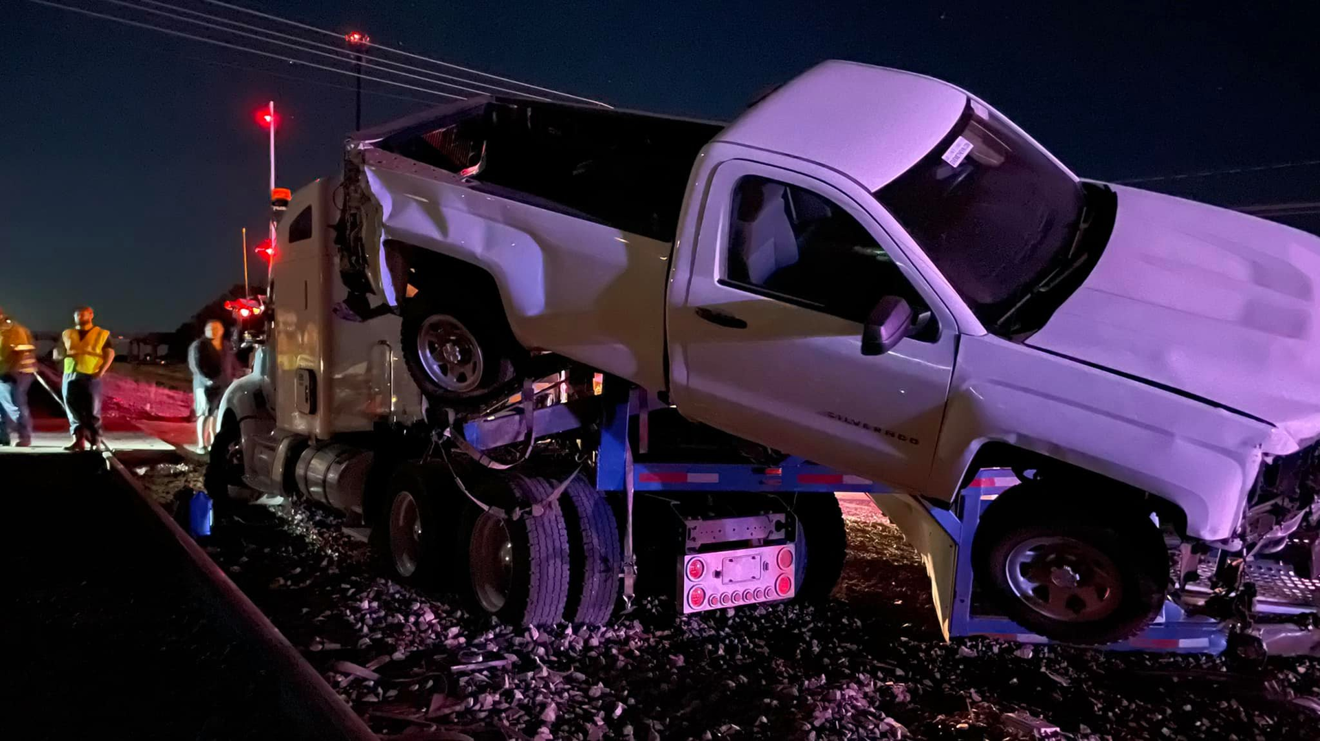 A car hauler was smashed in Oklahoma on Friday after following GPS onto the tracks where the low-riding trailer became stuck.