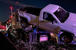 A car hauler was smashed in Oklahoma on Friday after following GPS onto the tracks where the low-riding trailer became stuck.