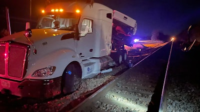The driver of this 2014 Kenworth T680 exited the truck with his dog before the train struck the rig on Friday evening near Thackersville, Okla.