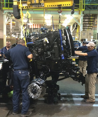 Paccar technicians building a truck