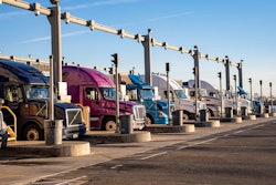 Trucks waiting at Port of Los Angeles new container fees