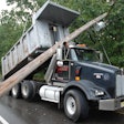 Police say this dump truck was traveling with a raised bed when it brought down power lines this week in Manchester Township, N.J.