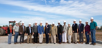 Men and women pose for a picture on the site of a new truck stop to be in Statesboro, Georgia