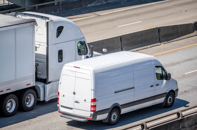 truck and van on the highway